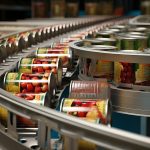 Canned goods on a factory conveyor belt.